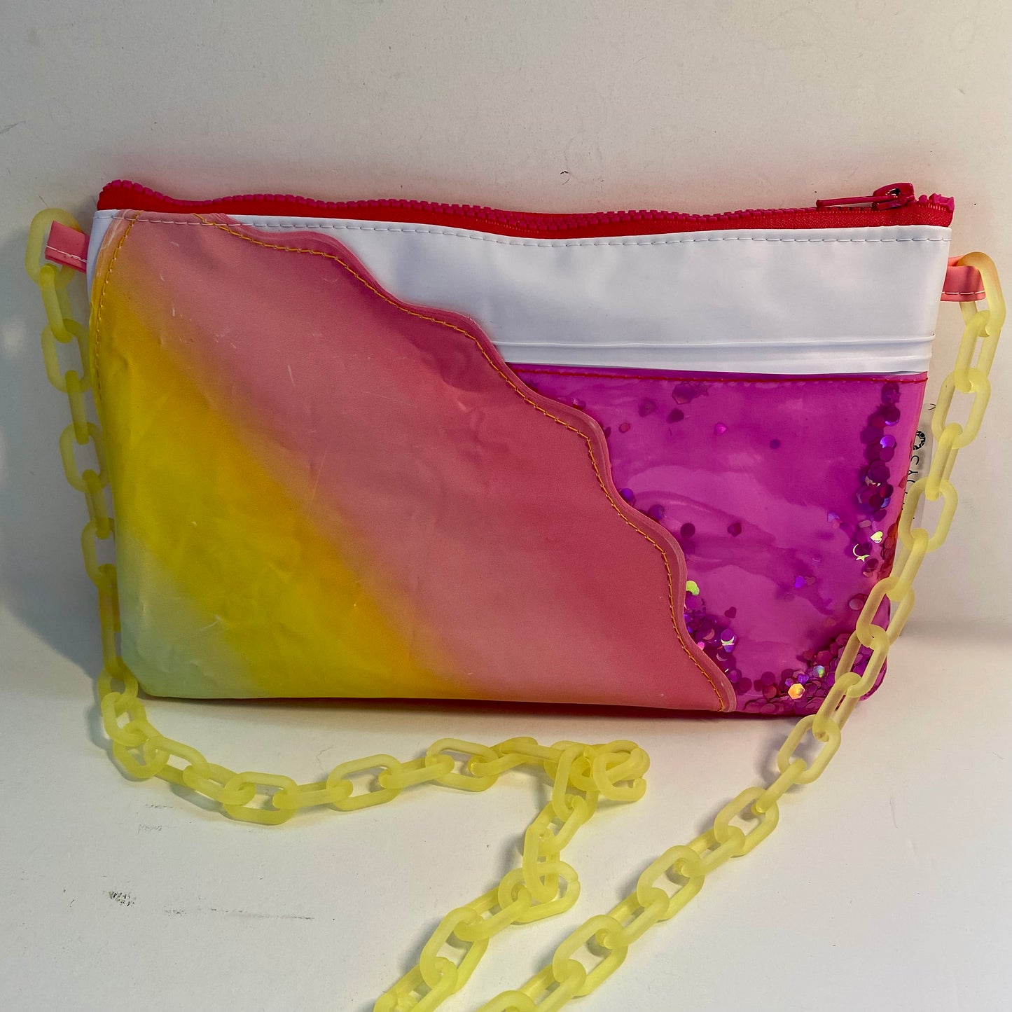 Sunset coloured purse sustainably made from upcycled pool inflatables