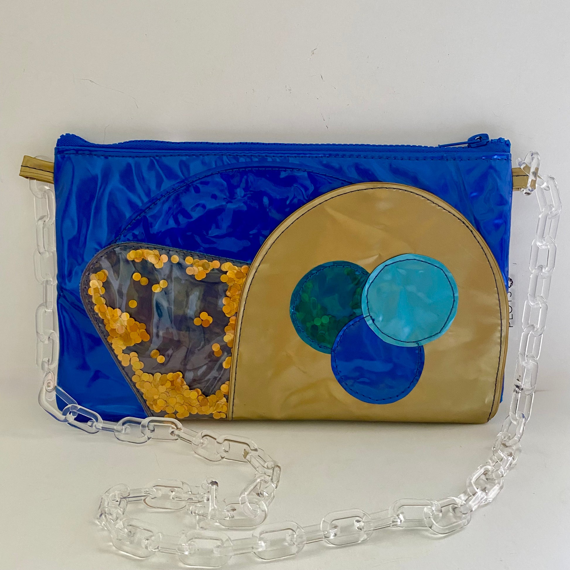 Pearl blue purse with golden detail sustainably made from upcycled pool inflatables