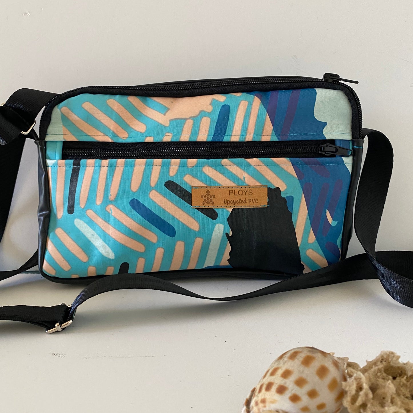 Unique waterproof shoulder bag in biker style made from recycled and upcycled air mattresses
