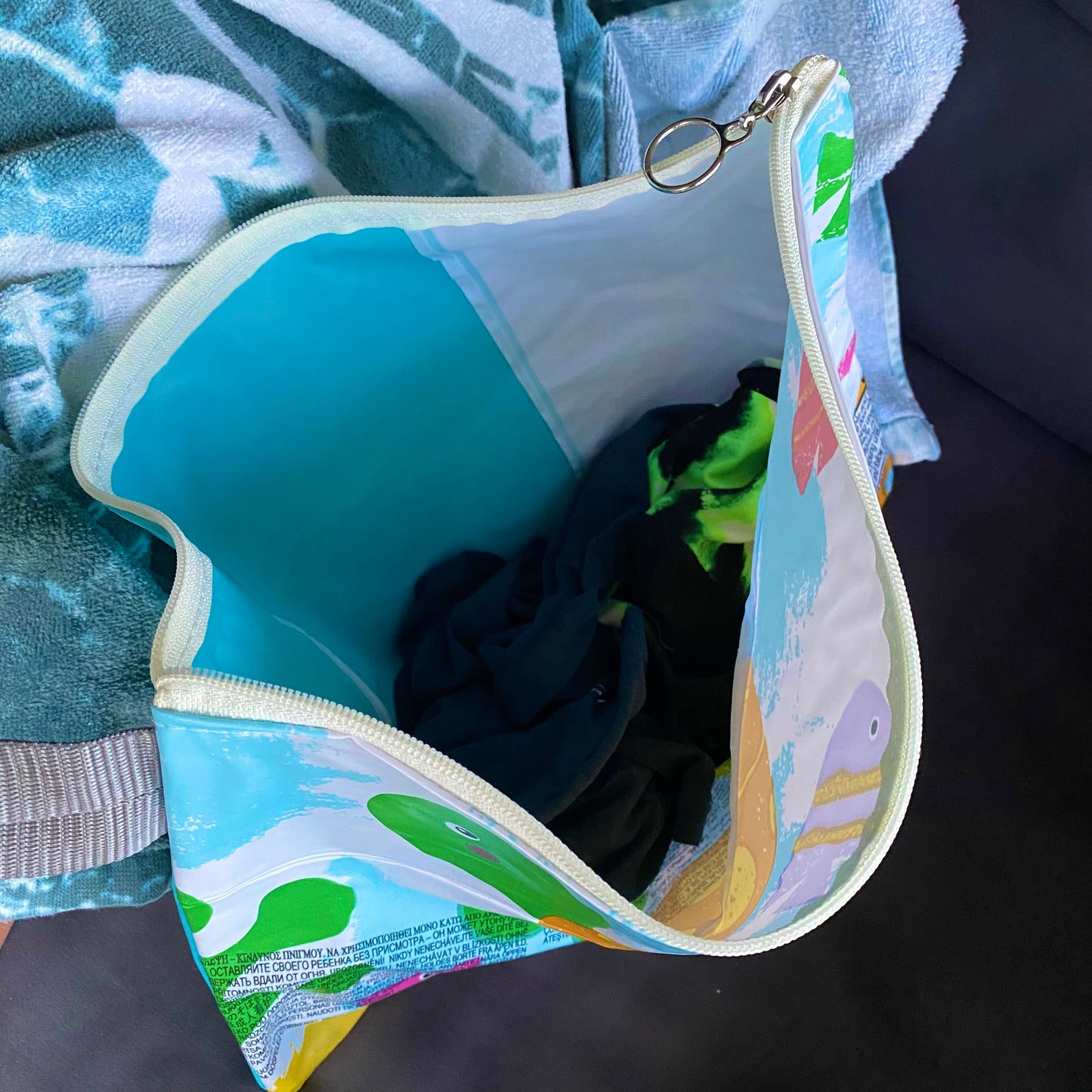 Waterproof Wet and Dry Bag sustainably made from upcycled plastics, the best eco bag for swimmers and babies nappies for daycare.