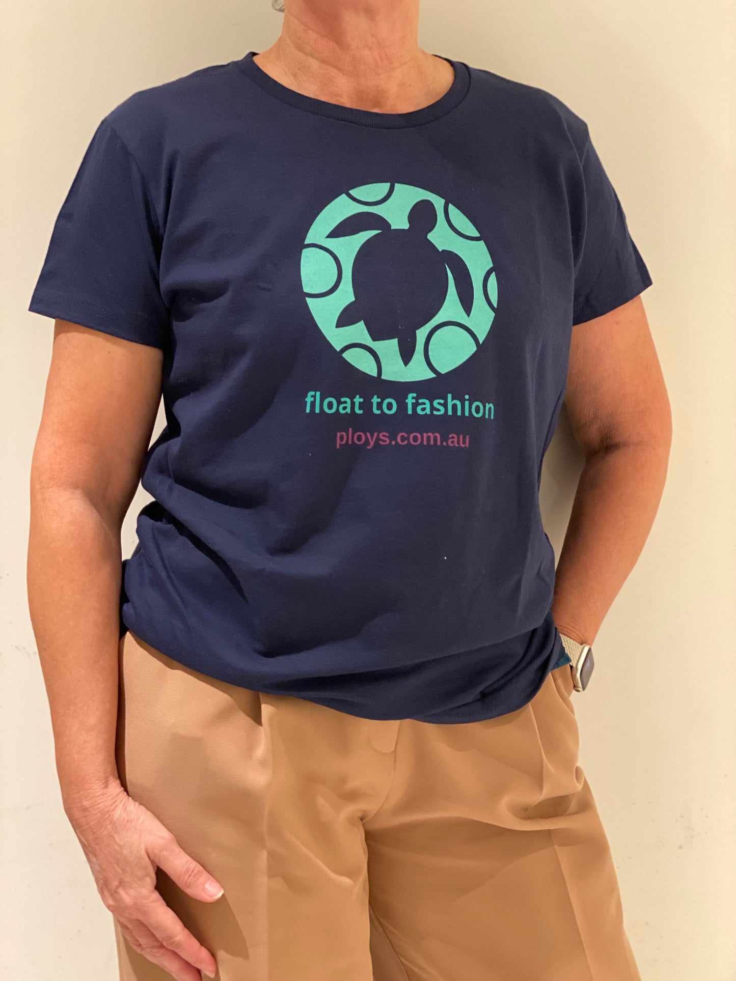 Eco sea turtle tshirt with message to keep oceans plastic free in blue and teal and float to fashion text reflecting the PLOYS brand sustainable values