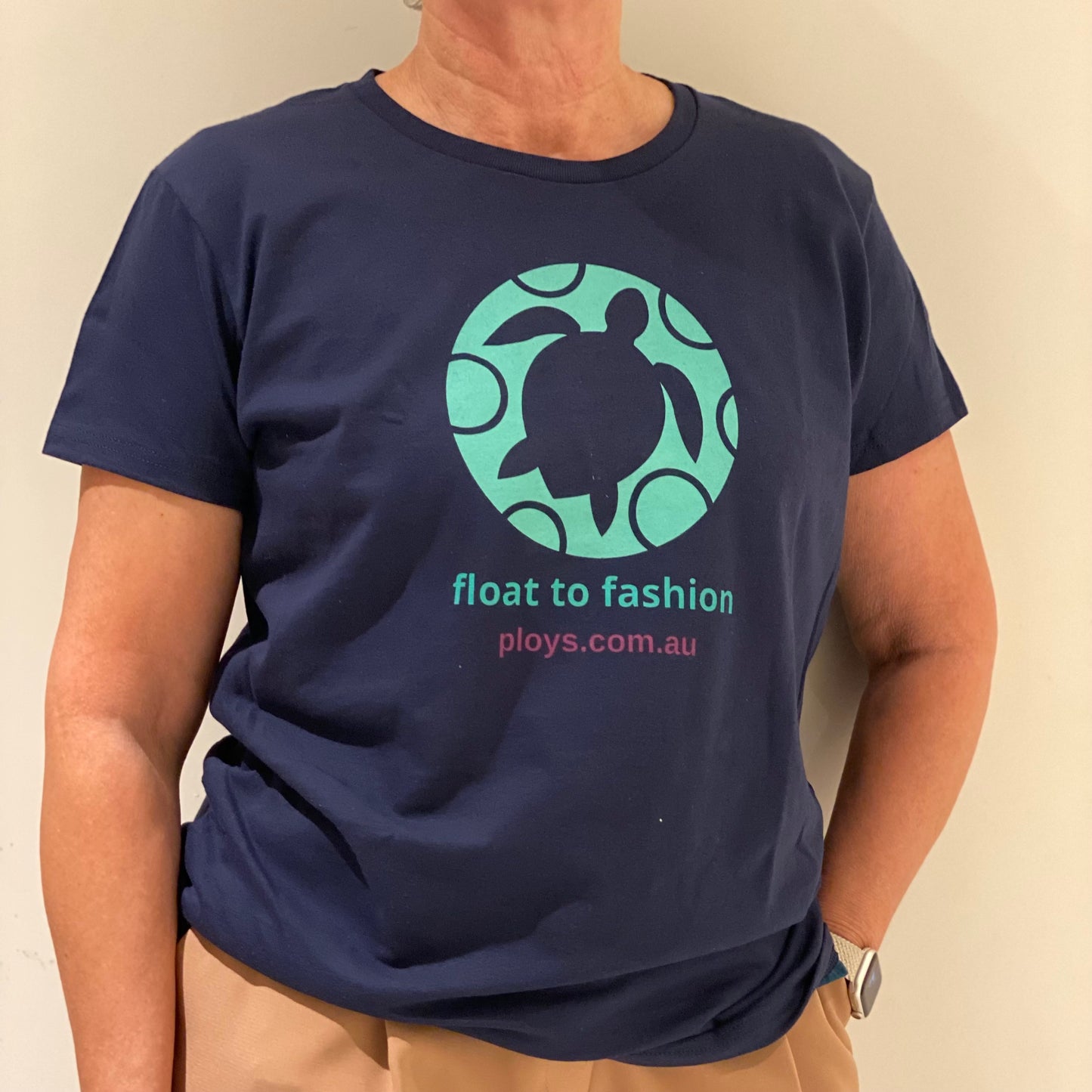 Eco sea turtle tshirt with message to keep oceans plastic free in blue and teal and float to fashion text reflecting the PLOYS brand sustainable values