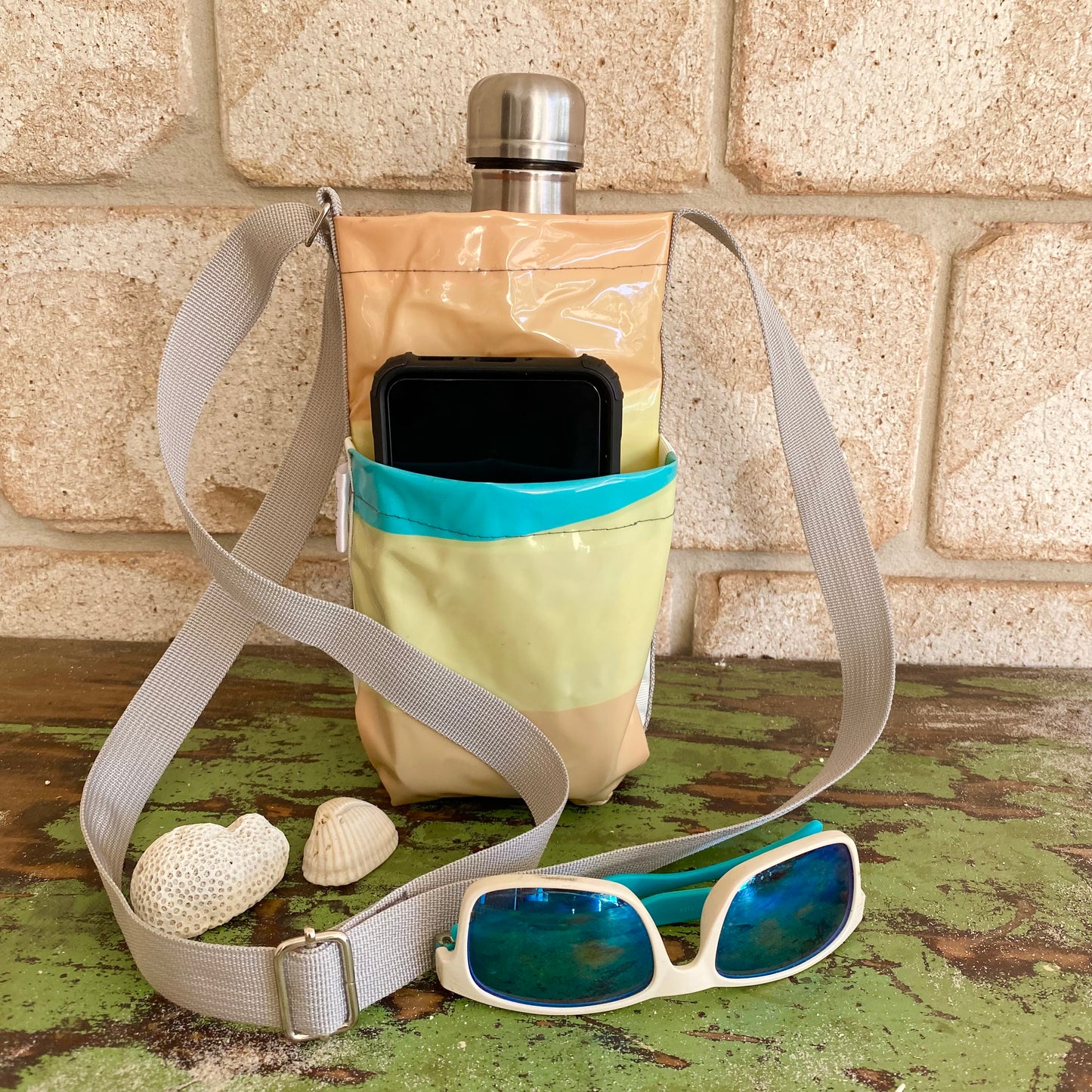 Water Bottle & Mobile Phone Carrier made from recycled pool inflatables