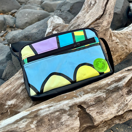 Upcycled cross body bag made from repurposed inflatables in bold colours