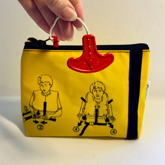 Cosmetics bag for toiletries upcycled from an airline life jacket, it’s light and waterproof perfect for travel, first aid supplies and flight attendant