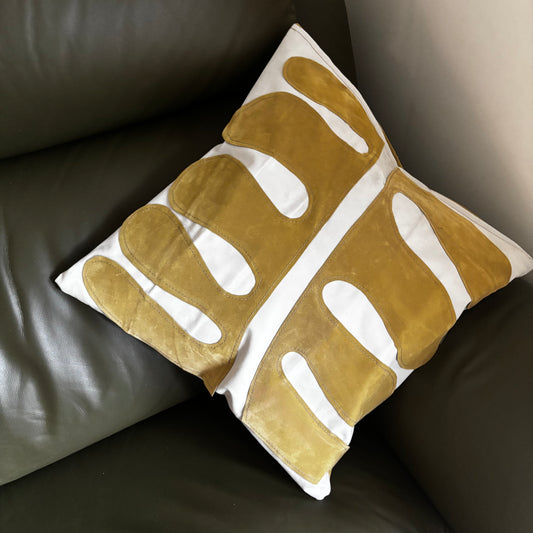 Eco-friendly cushion covers with yellow leaf pattern crafted from upcycled inflatable air mattresses, durable, wipeable and weather-resistant