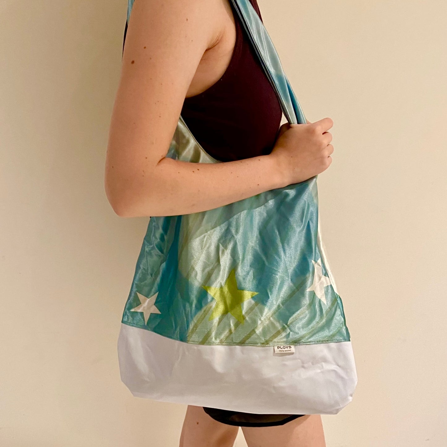 Unique shoulder bag in boho hobo style made from recycled flags and banners fabrics