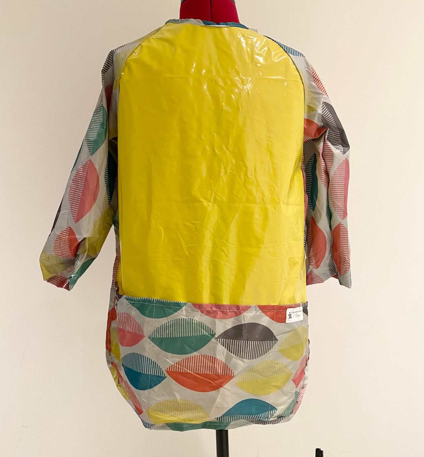 Art smock, water resistant recycled pool inflatables and shower curtain