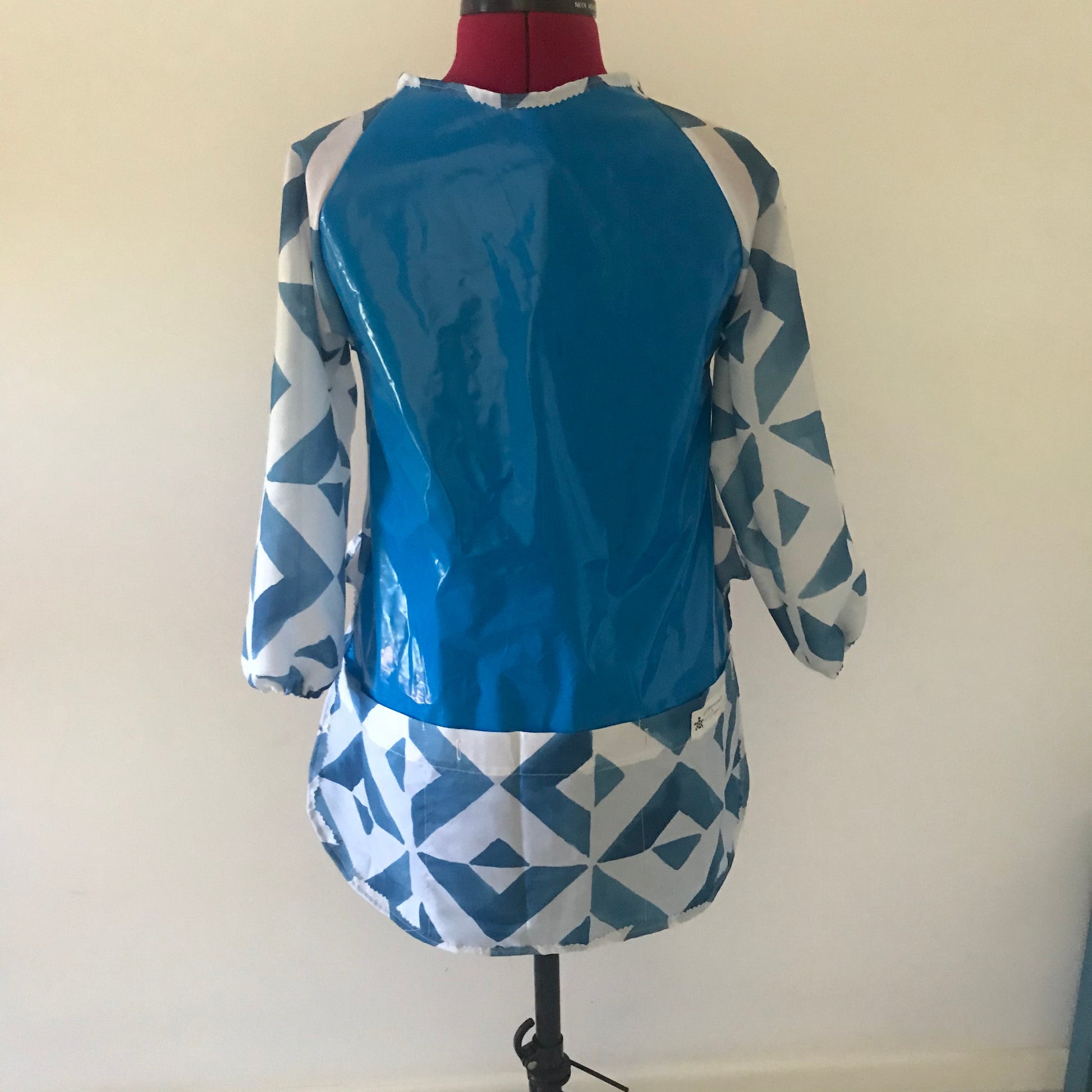 Art smock, water resistant recycled pool inflatables and shower curtain