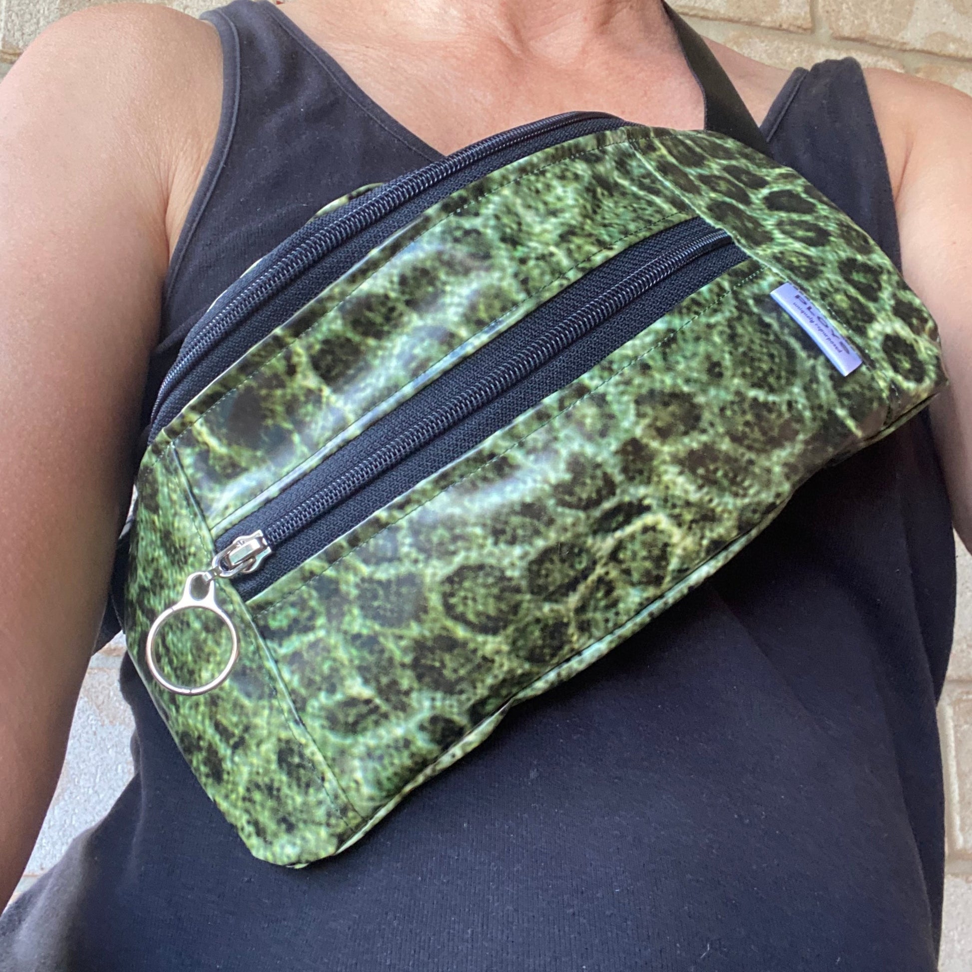 Bum bag or Belt bag made from recycled pool inflatables, weatherproof and spacious, large enough to fit wallet or water bottle. 100% recycled plastics.