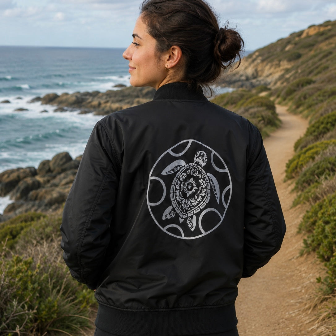 Bomber jacket made from 100% recycled plastic with turtle logo in black and white, warm for cooler temperatures