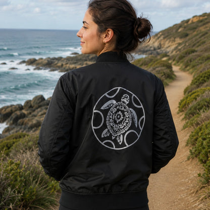 Bomber jacket made from 100% recycled plastic with turtle logo in black and white, warm for cooler temperatures