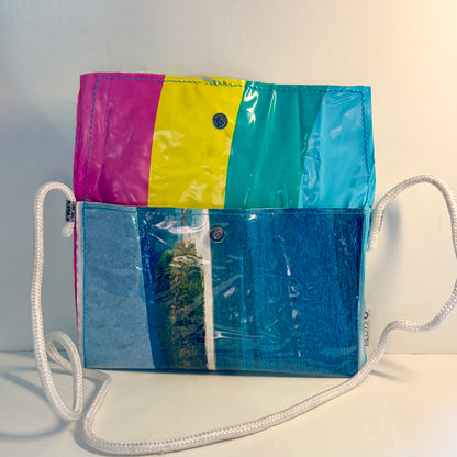 Vinyl art canvas clutch purse or cross body bag made from clear vinyl upcycled pvc sewn into sustainable purse