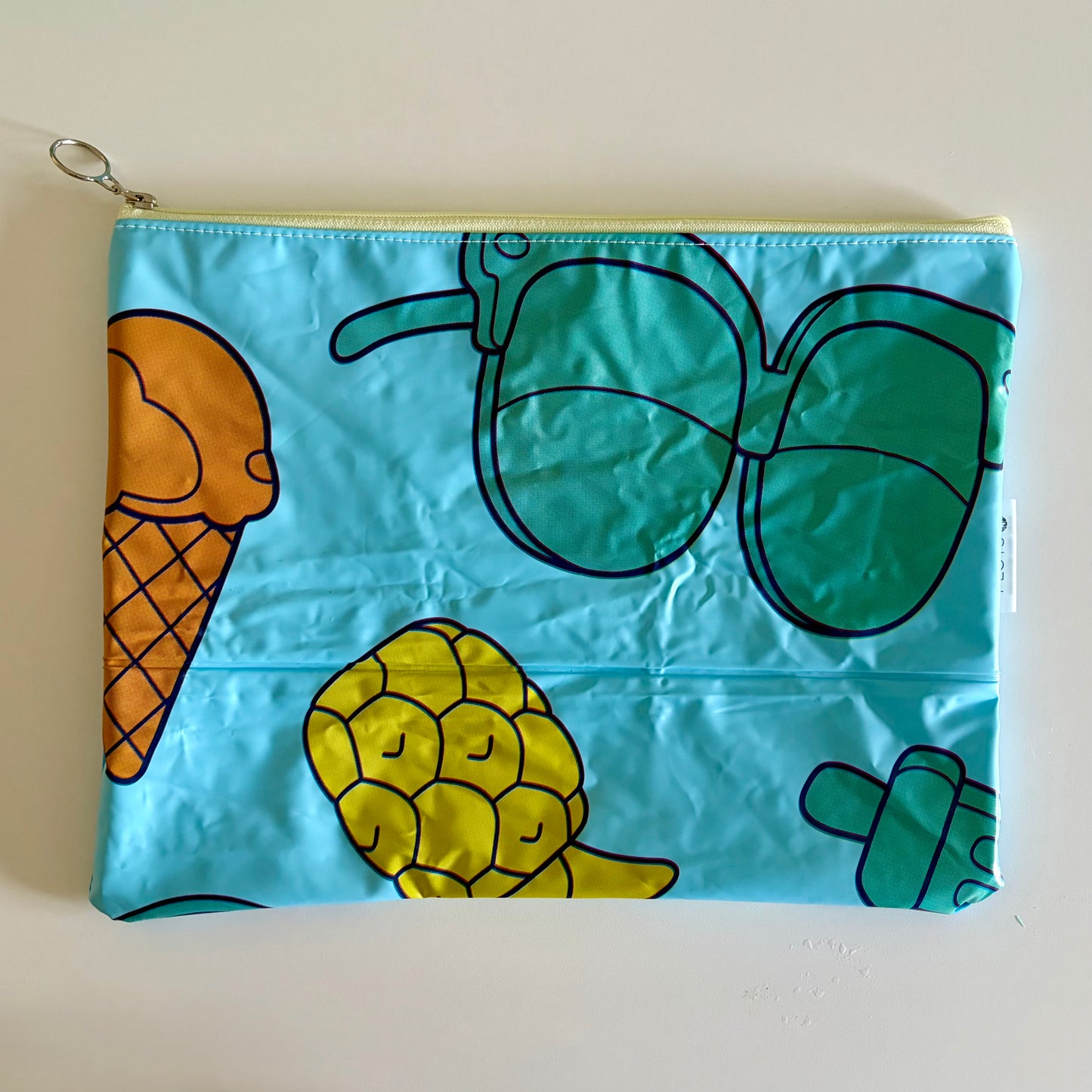 Wet Bag waterproof made from recycled pool floats with bright fun beach pattern recycling plastic waste 