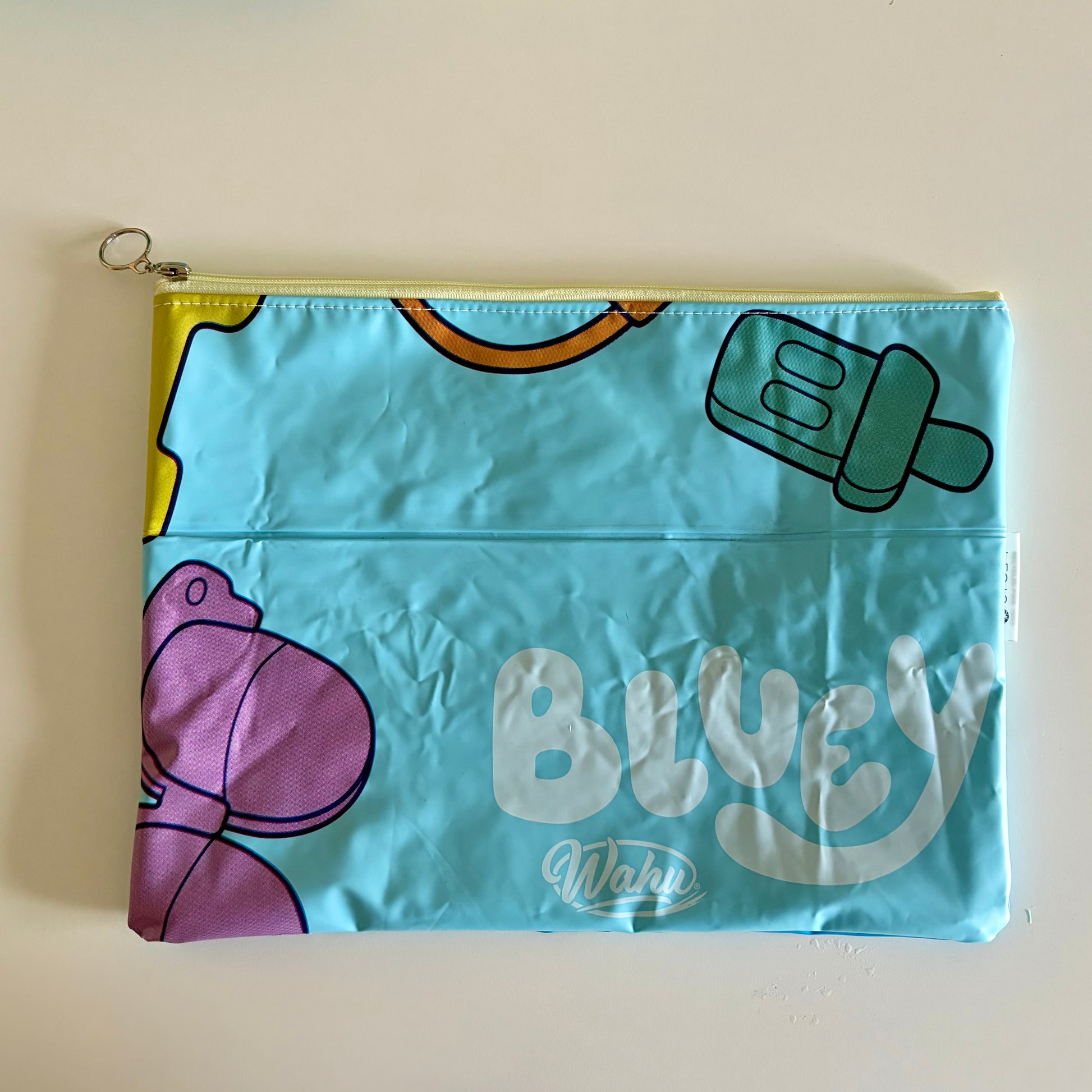 Bluey Wet Bag waterproof made from recycled pool floats with bright fun beach pattern recycling plastic waste 
