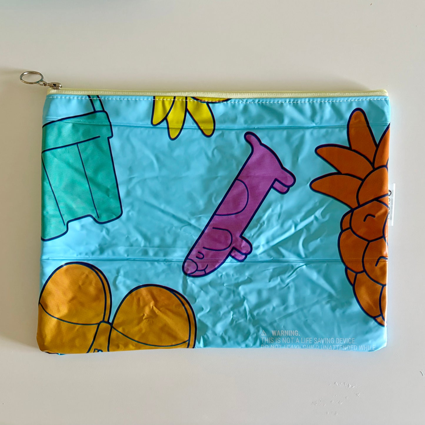 Wet Bag waterproof made from recycled pool floats with bright fun beach pattern recycling plastic waste 