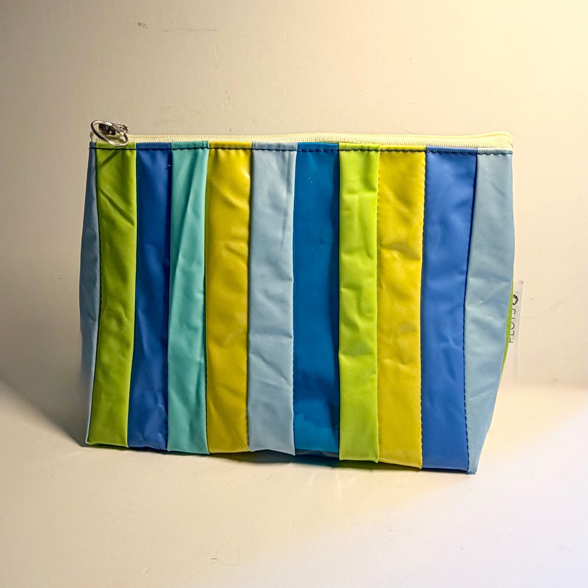 Upcycled pvc Striped cosmetics pouch made from recycled pool inflatables with blue and green ideal as wet bag 