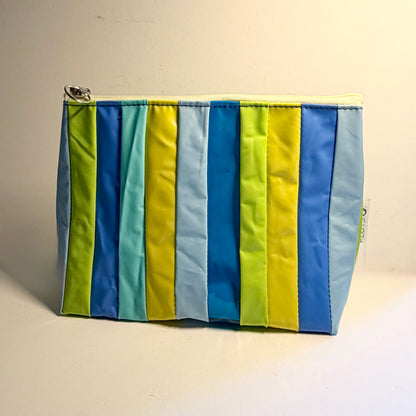 Upcycled pvc Striped cosmetics pouch made from recycled pool inflatables with blue and green ideal as wet bag 