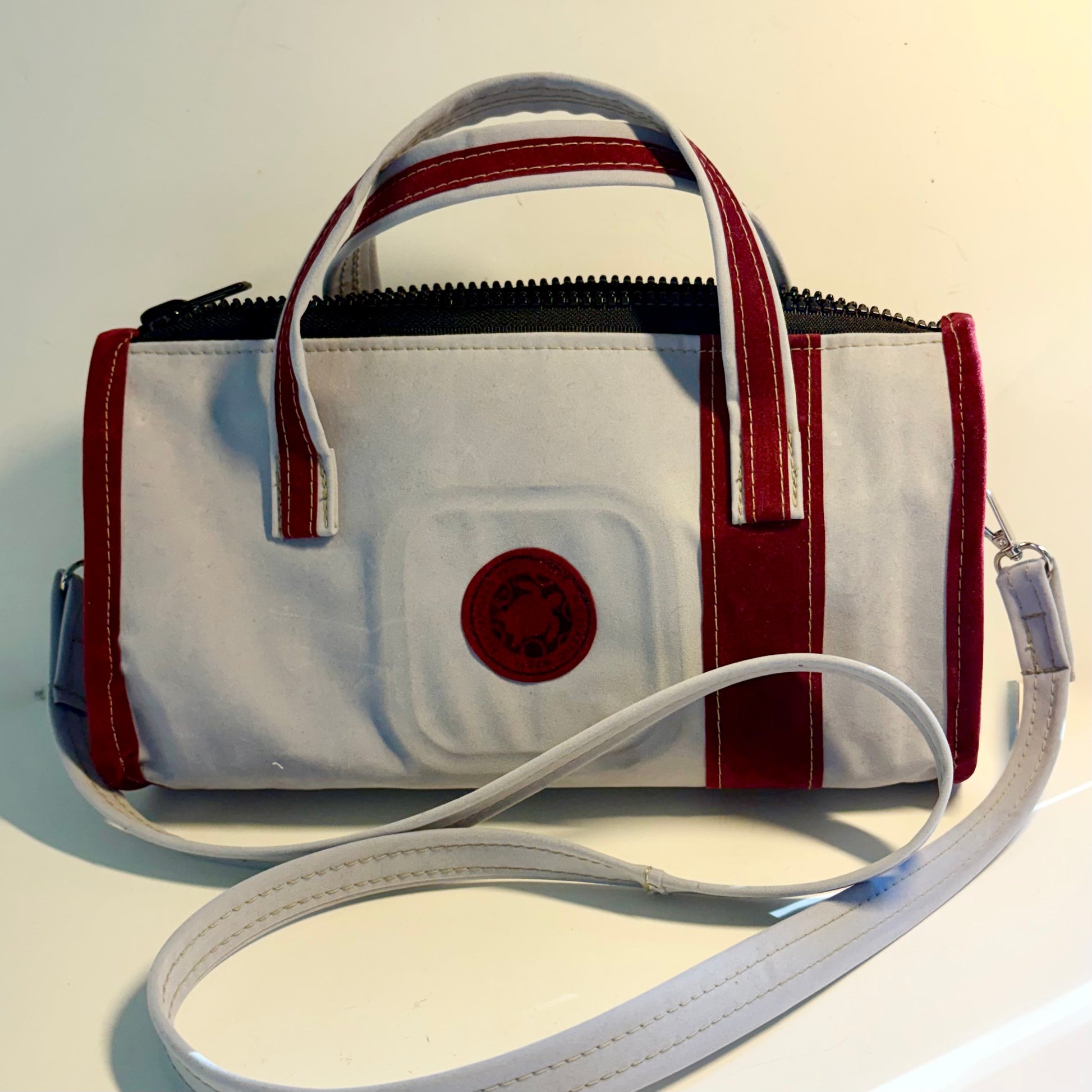 Sustainable recycled eco hand bag in retro 1950 style made from punctured inflatables 