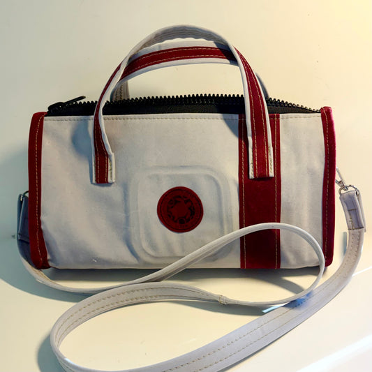 Sustainable recycled eco hand bag in retro 1950 style made from punctured inflatables 