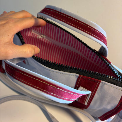 Sustainable recycled eco hand bag in retro 1950 style made from punctured inflatables 
