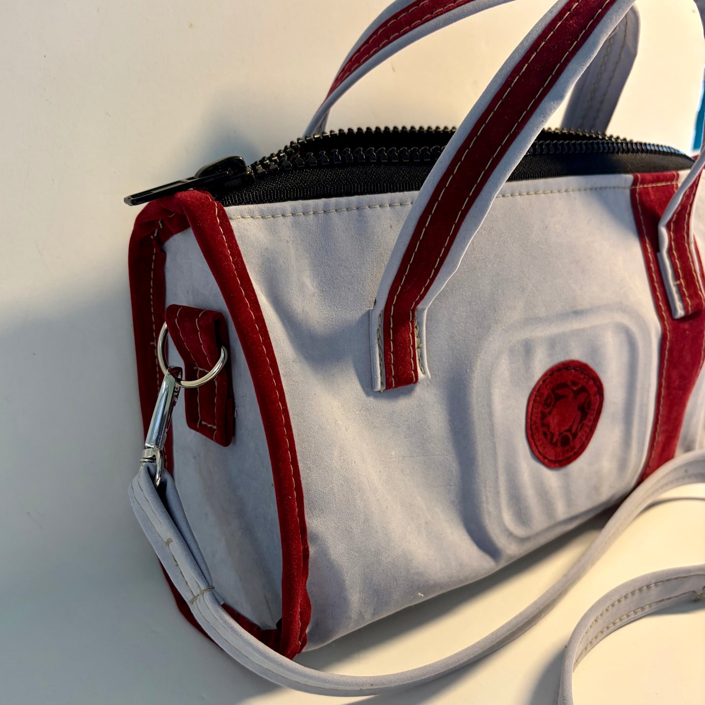 Sustainable recycled eco hand bag in retro 1950 style made from punctured inflatables 