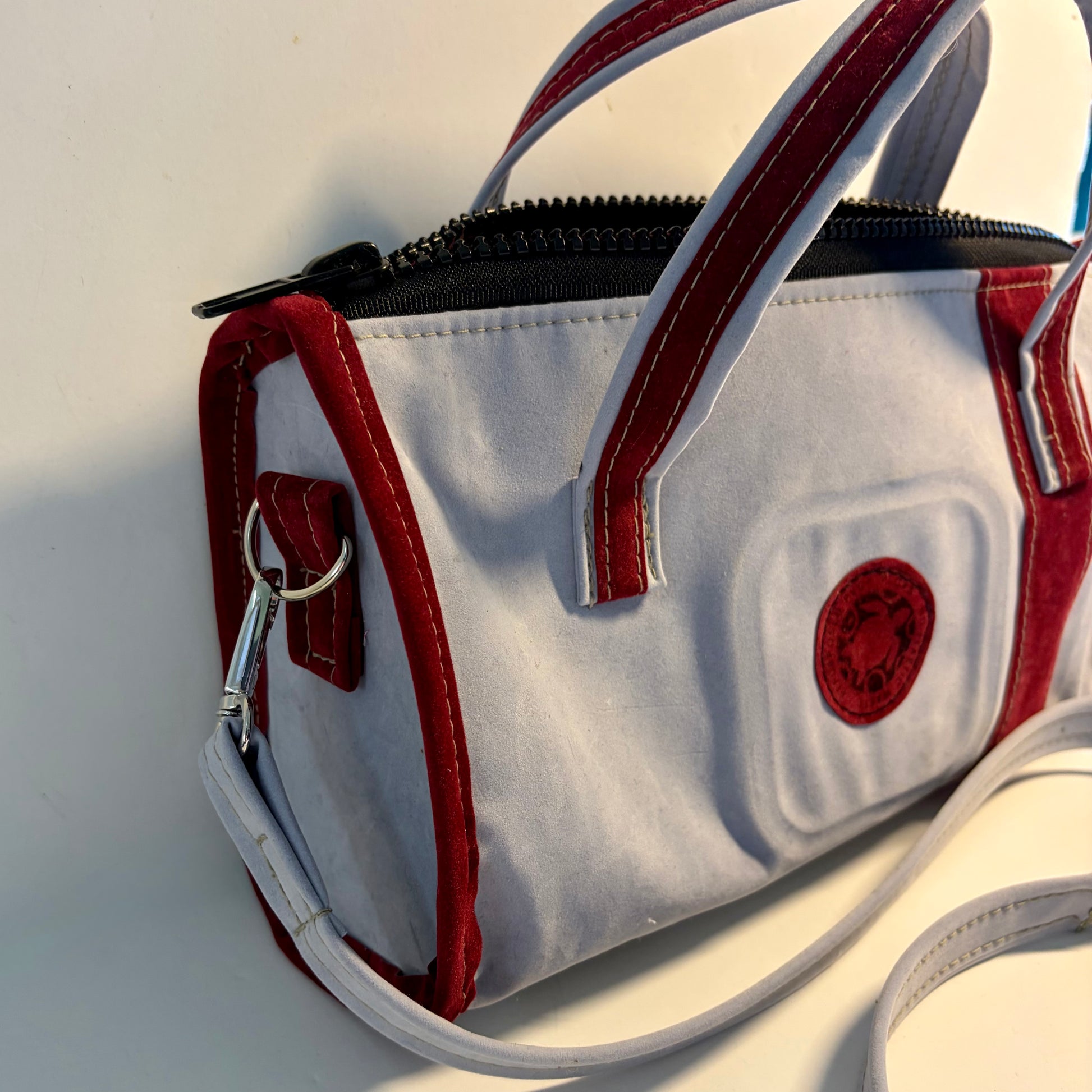 Sustainable recycled eco hand bag in retro 1950 style made from punctured inflatables 