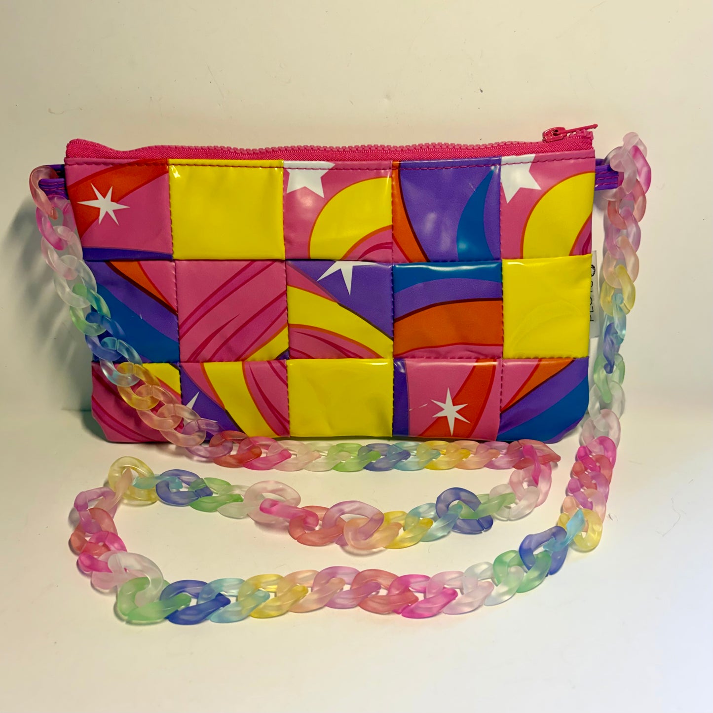 Colourful rainbow waterproof patchwork purse sustainably made from recycled plastic with a multicoloured chain strap