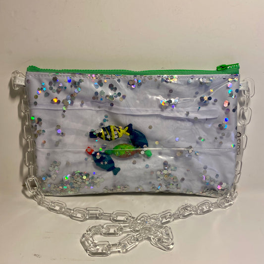 White and Silver glitter purse with soy fish displayed in sustainably made from upcycled pool inflatables