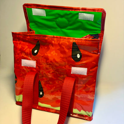 Lunch box bag fully waterproof and insulated made from recycled plastic pool inflatables from a watermelon swim ring.