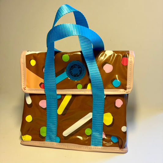 Lunch box bag waterproof and insulated made from recycled plastic pool inflatables from a donut pool ring