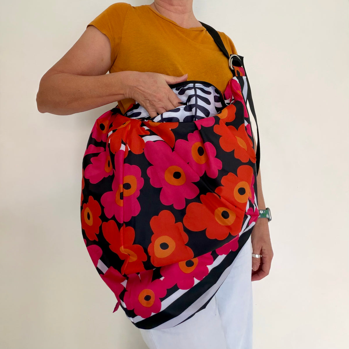 Tasuki duffel bag made from upcycled colourful umbrellas perfect weekend away, light waterproof and spacious with long adjustable shoulder strap.