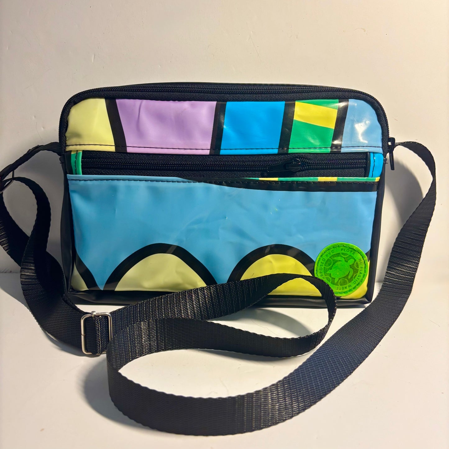 Eco Colourful cross body bag made from upcycled inflatables with a black adjustable strap