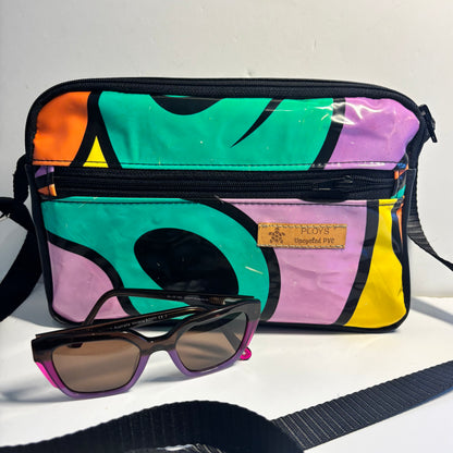 Upcycled cross body bag made from repurposed inflatables in bold colours