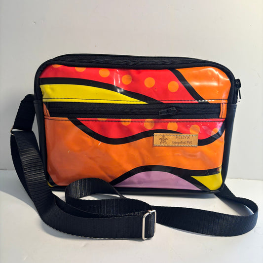 Upcycled cross body bag made from repurposed inflatables in bold colours