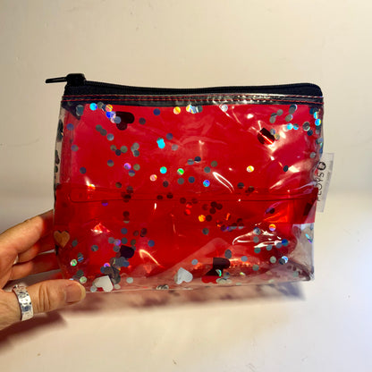 Upcycled cosmetics purse handmade from repurposed pool inflatables using recycled PVC plastic.