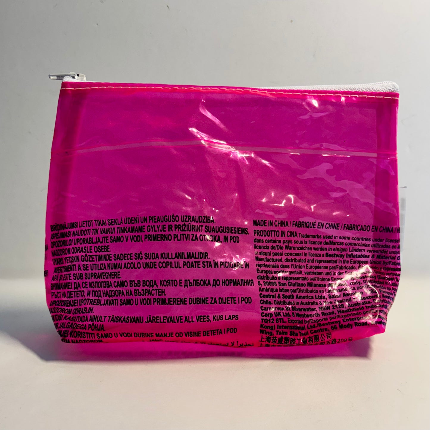 Upcycled cosmetics purse handmade from repurposed pool inflatables using recycled PVC plastic.