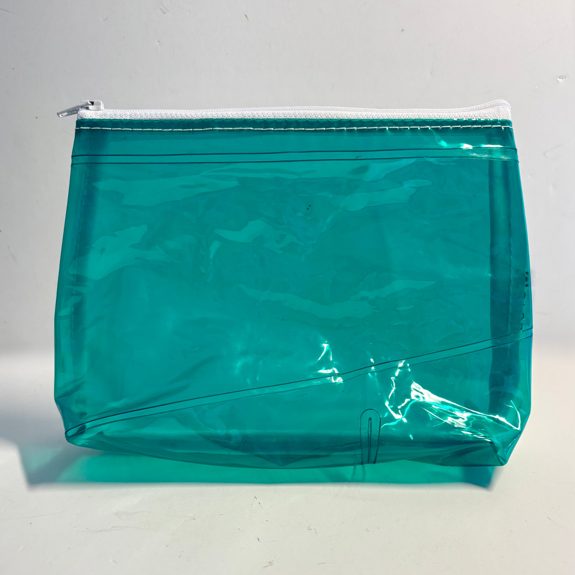 Upcycled cosmetics purse handmade from repurposed pool inflatables using recycled PVC plastic.