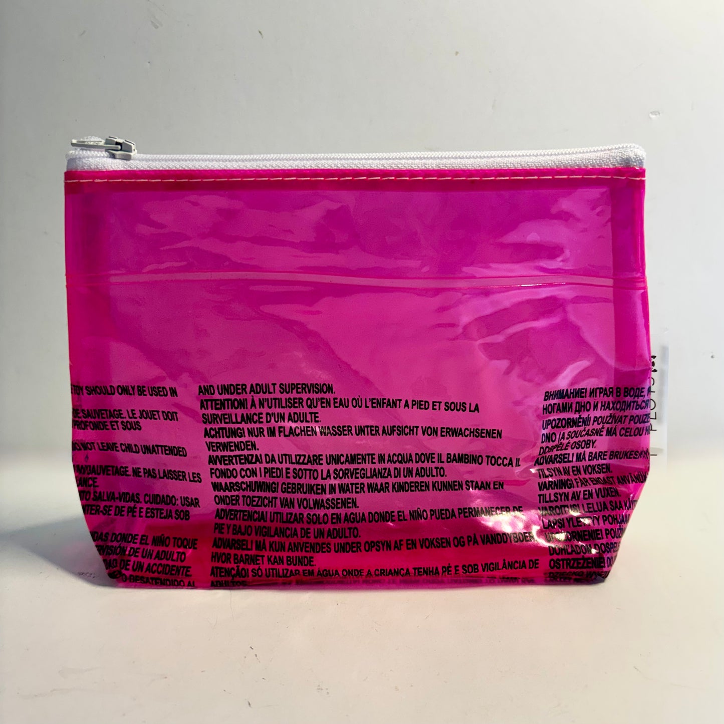 Upcycled cosmetics purse handmade from repurposed pool inflatables using recycled PVC plastic.