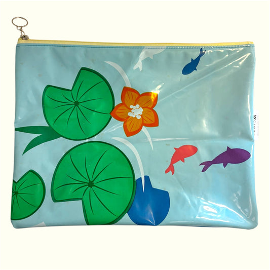 A3 waterproof wet bag zipper pouch made from recycled PVC pool inflatables. Designed to store wet swimwear, reusable nappies, beachwear and soiled clothing. Lightweight, durable and sustainable—ideal for swimming, travel and everyday use.