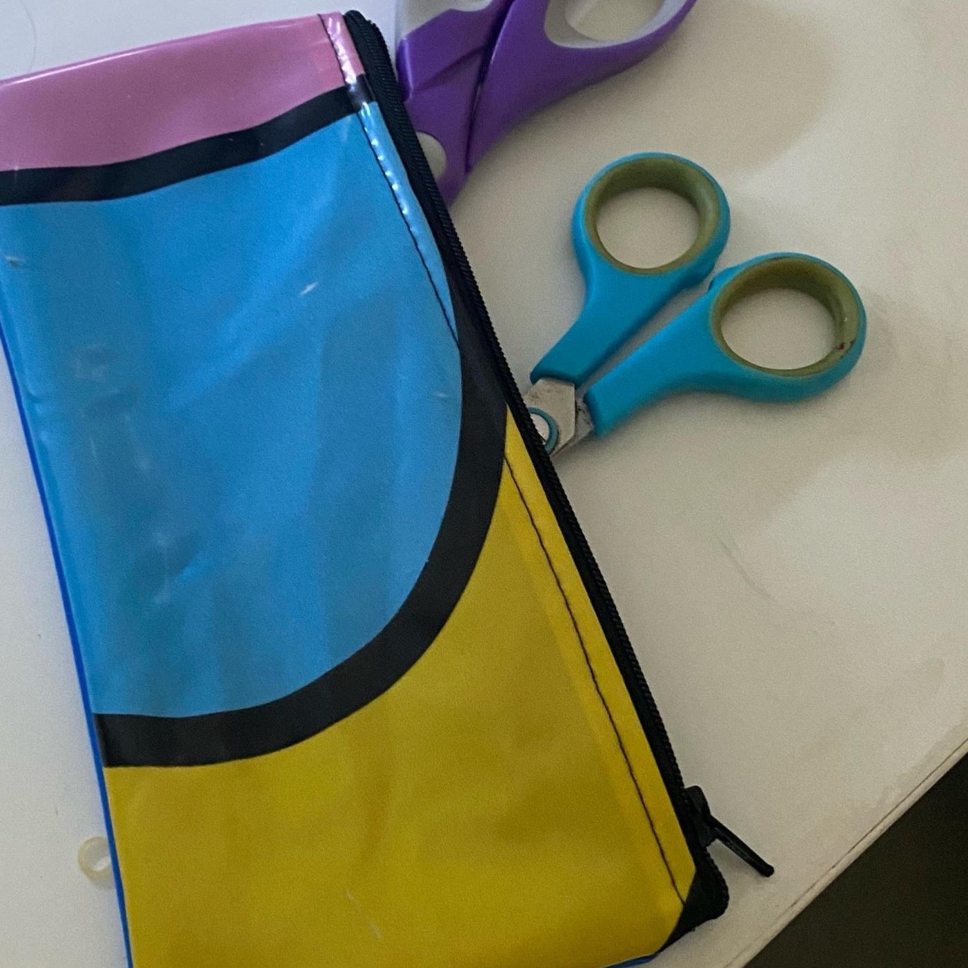 Medium size purse made from recycled pool inflatables ideal as pencil case or for mobile phone, sunglasses or cosmetics.