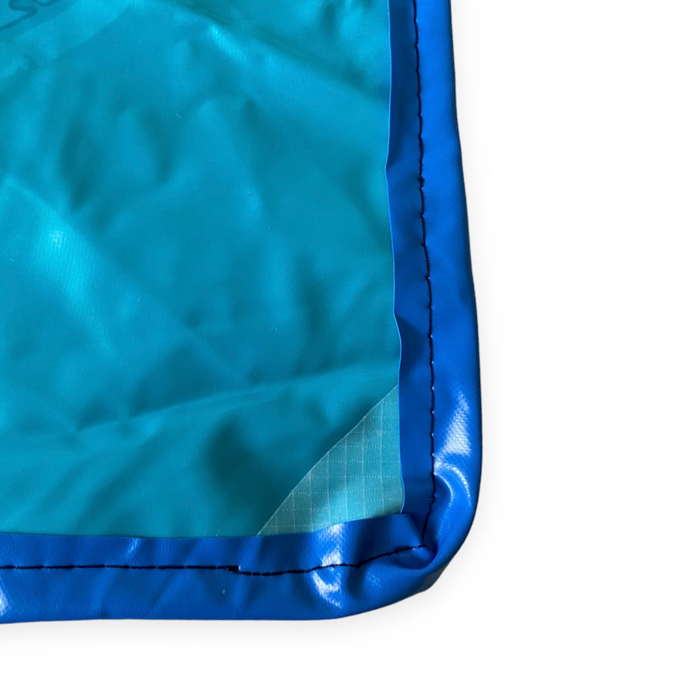 Wet bag from 100 % recycled pool inflatables, perfect for boating, swimming, beach or as book bag. Water resistant.  Showing reinforced corners