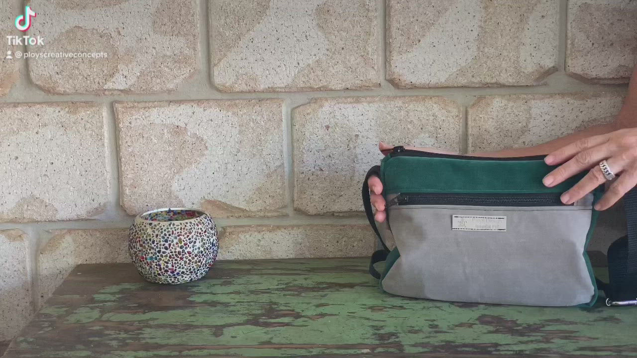Video of packing the cross body bag with wallet, glasses, cosmetics and more